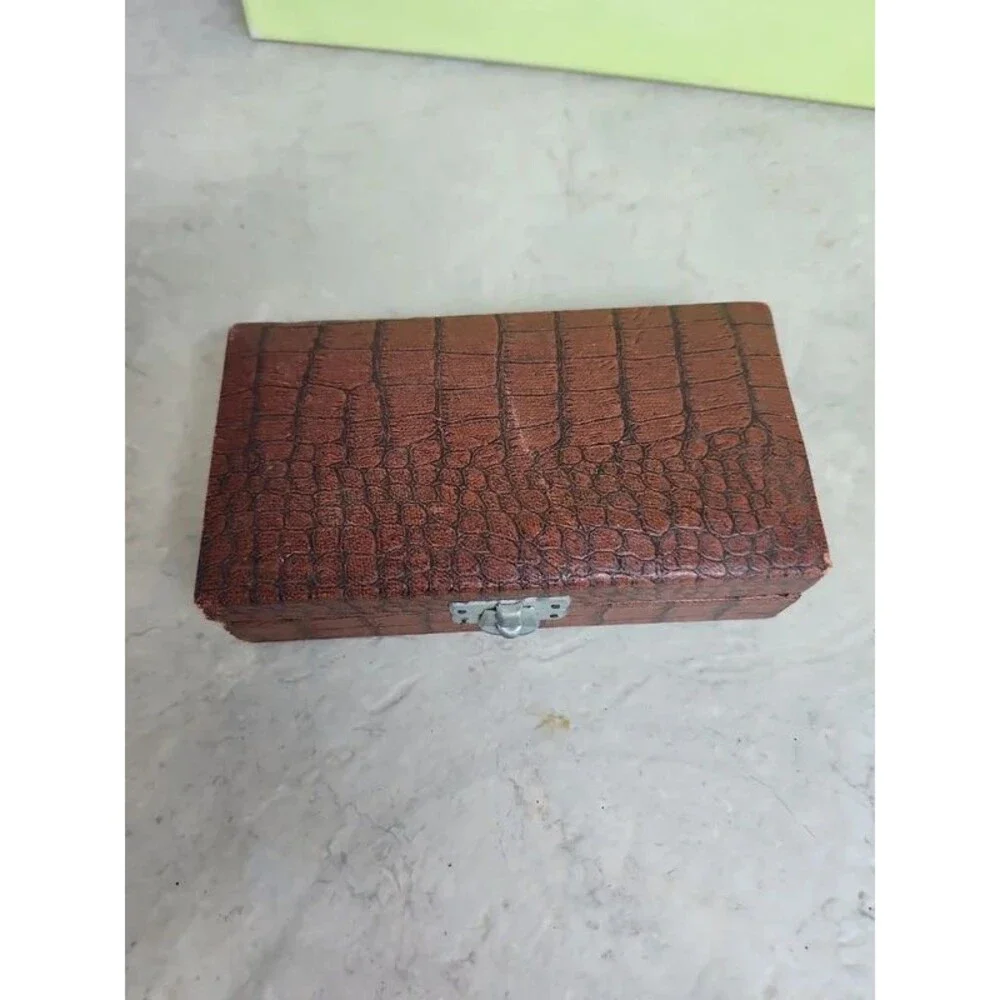 Faux alligator velvet lined box filled with charms